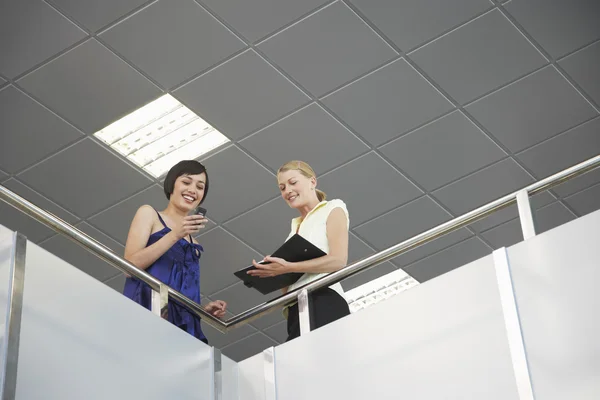 Businesswomen in Meeting on Balcony