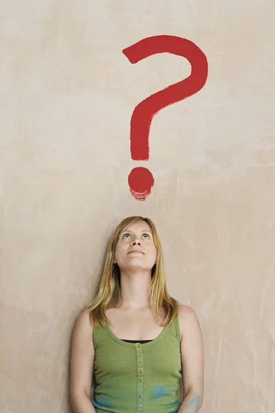 Woman Looking at Question Mark