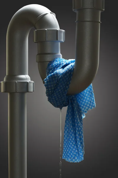 Leaking pipe with towel