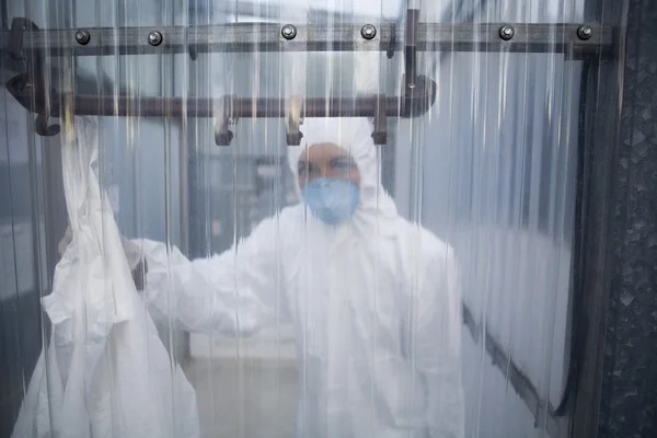 Female Worker in protective mask