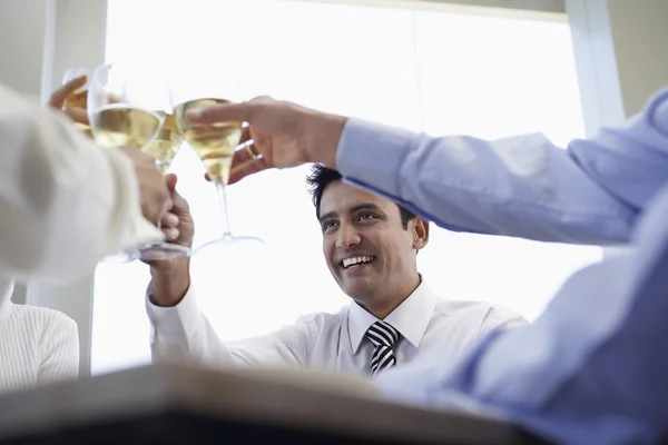 Business associates toasting
