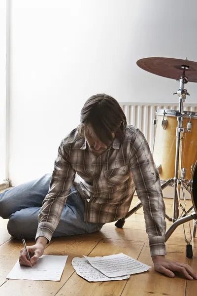 Man near drum kit