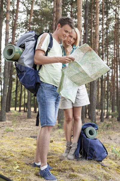 Hiking couple reading map