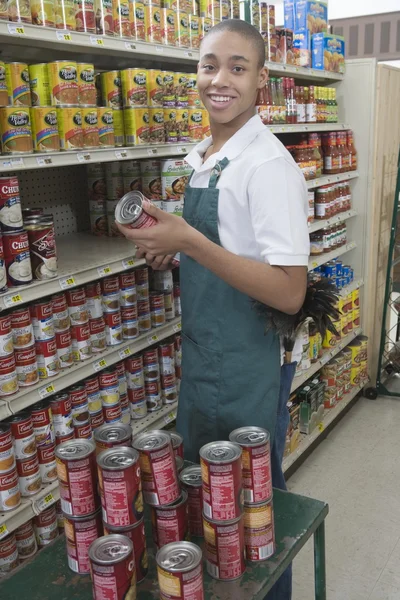 Teenage supermarket employee