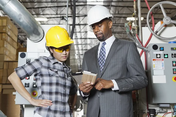 Female worker and male engineer