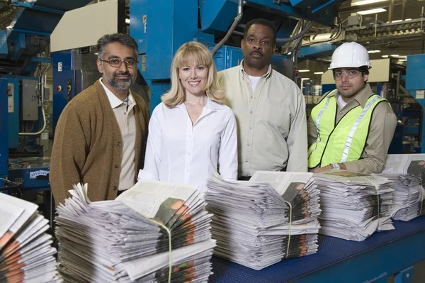 People working in newspaper factory
