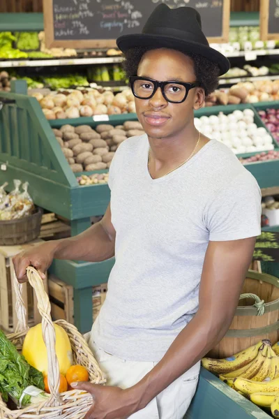 Man with basket at supermarket