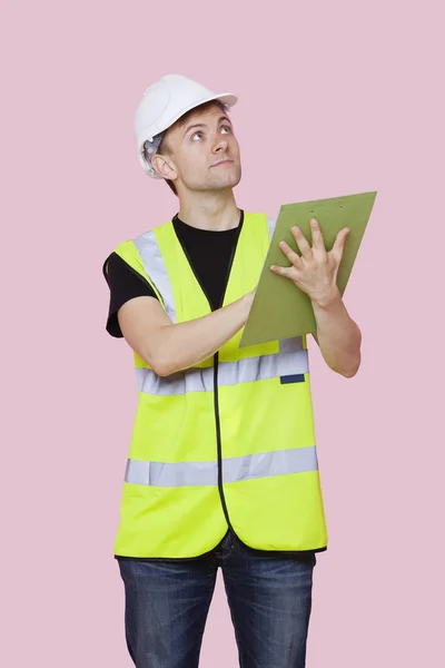 Construction worker with clipboard