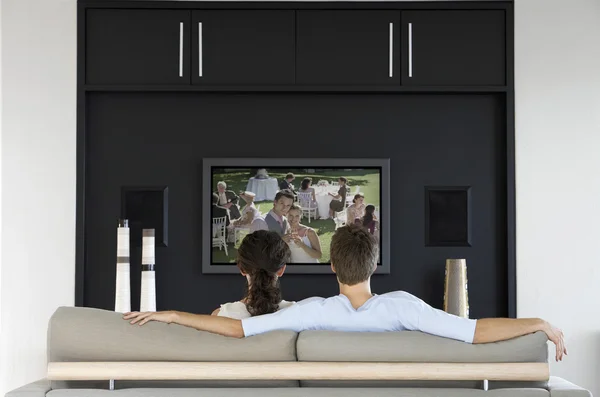 Couple watching movie on television