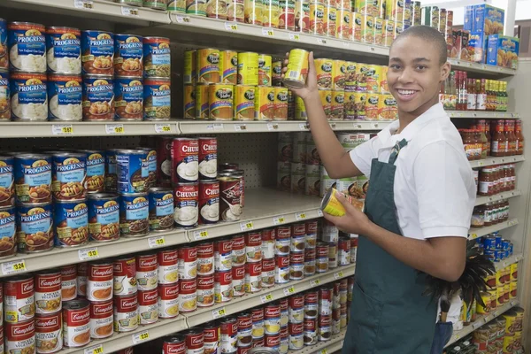 Teenage supermarket employee