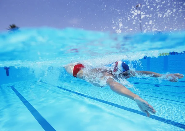 Male athlete swimming in pool