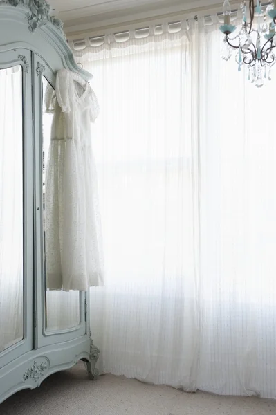 Christening gown on wardrobe