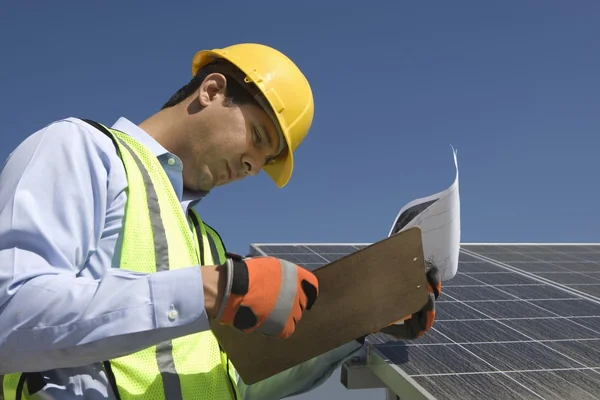 Maintenance worker with photovoltaic array