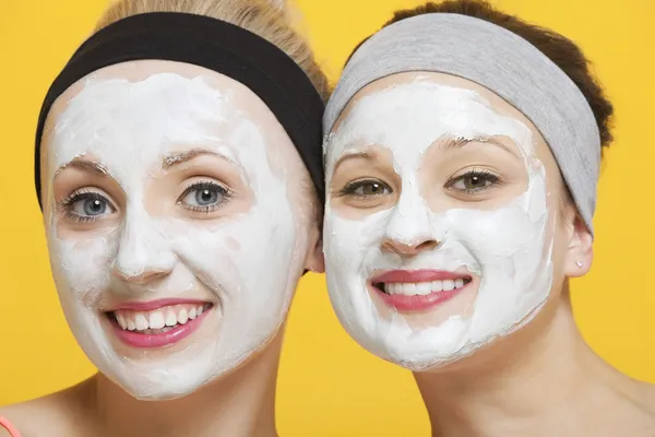 Happy women with face pack