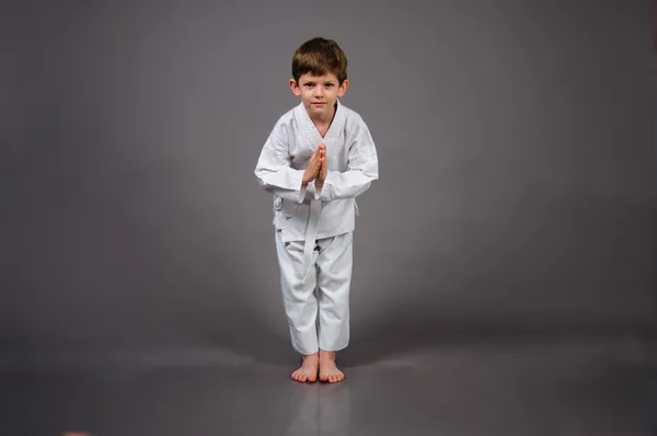 Karate boy in white kimono