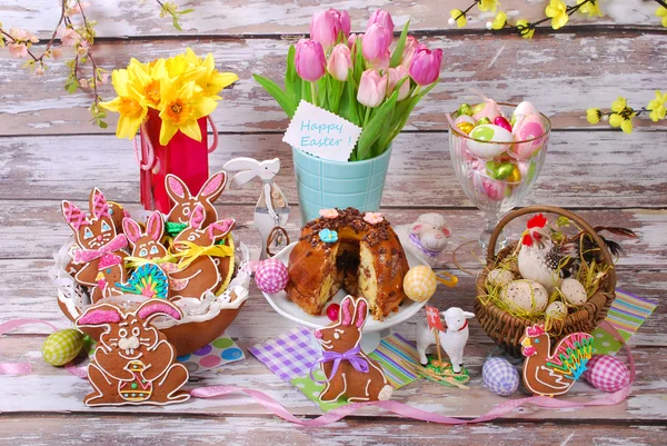 Easter table decoration with gingerbread cookies and ring cake