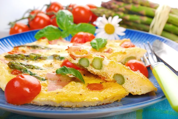 Frittata with green asparagus,ham and cherry tomato