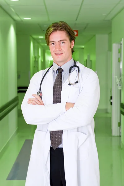 Handsome young male doctor portrait in hospital