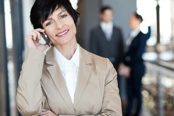 Middle aged businesswoman talking on cell phone