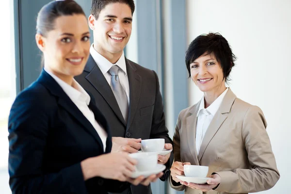 Group of businesspeople having coffee