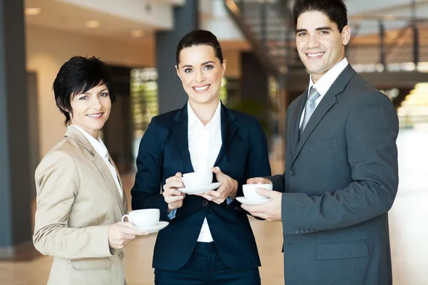 Group of colleagues having coffee break at work — Stock Photo #12288279