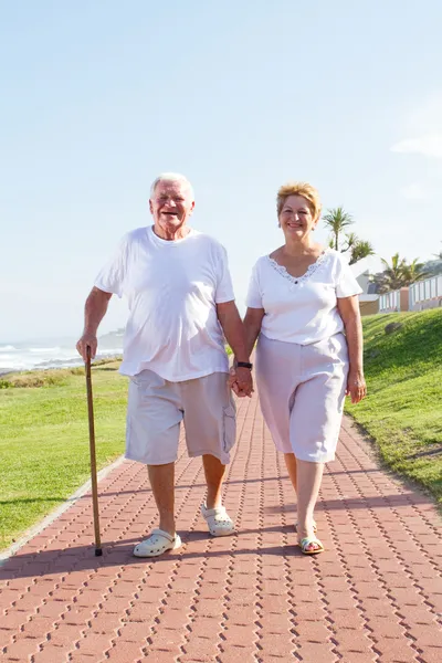 Happy senior couple walking