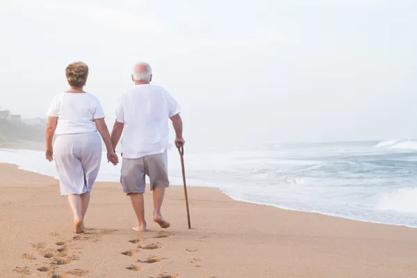 Senior couple hand in hand walking