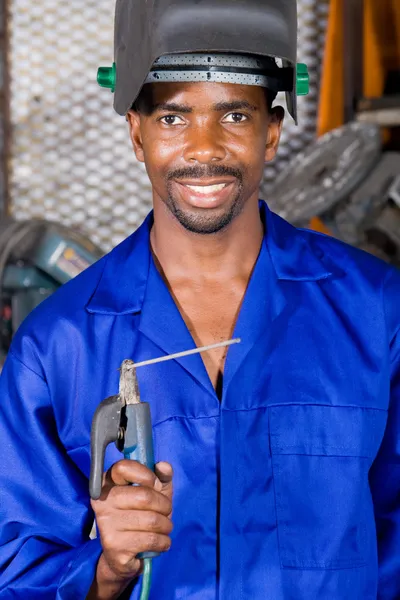 African american male welder with welding equipment