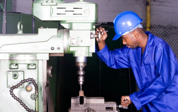 African american industrial drilling machine operator