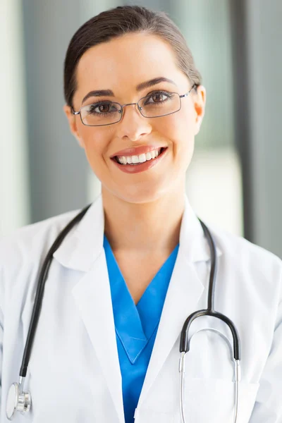 Attractive young medical worker closeup portrait in office