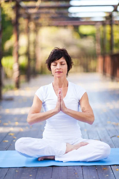 Middle aged woman yoga meditation