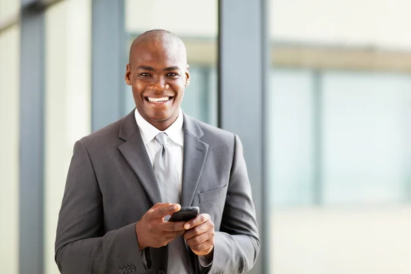 Young african business executive with smart phone