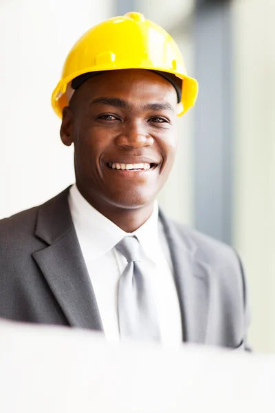 Handsome african american architect with construction plan