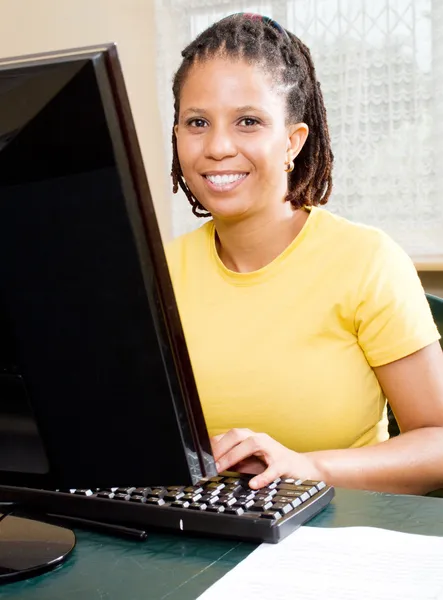 Mid age african american woman learning computer