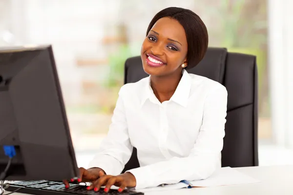 Young african american businesswoman working on computer