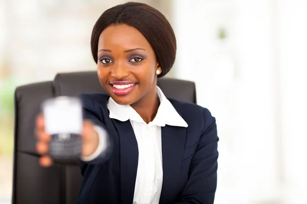 Pretty african american businesswoman showing message on smart phone