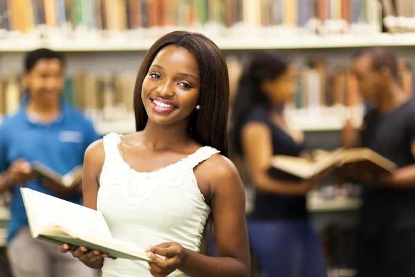 Beautiful african american college girl in library