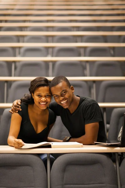 Happy african american college couple in lecture room