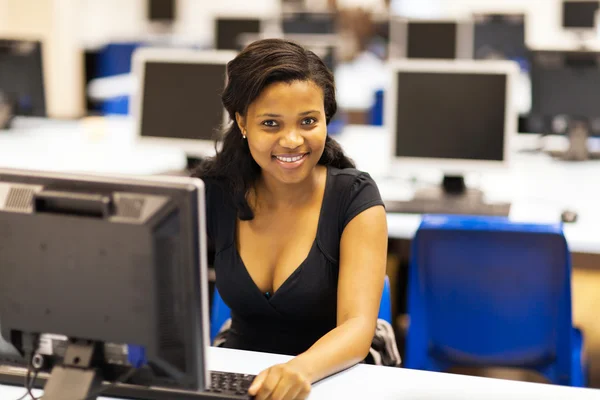 Beautiful female african american college student in computer room