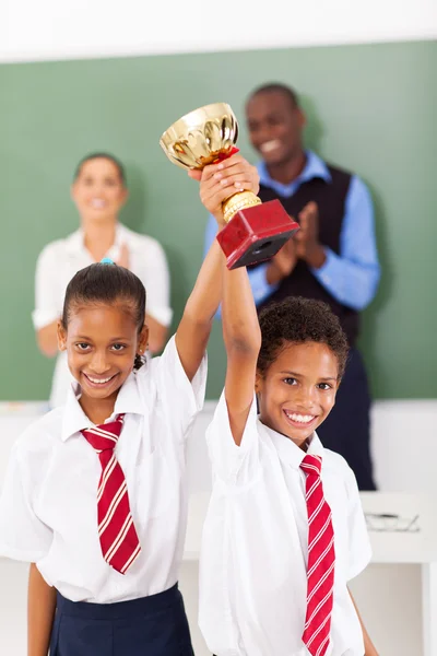 Students holding a trophy