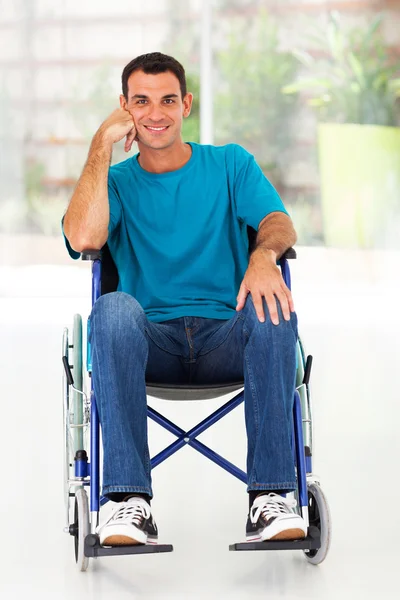 Happy disabled man sitting on wheelchair