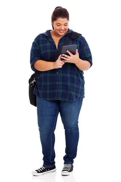 Plus size college student with tablet computer