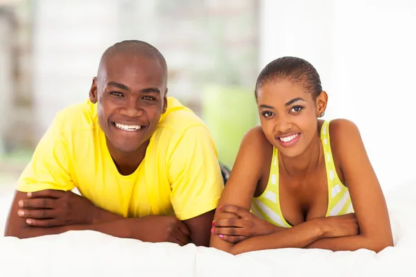 Young african couple in bed