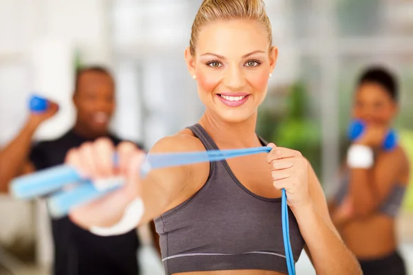 Woman exercise in gym with jumping rope