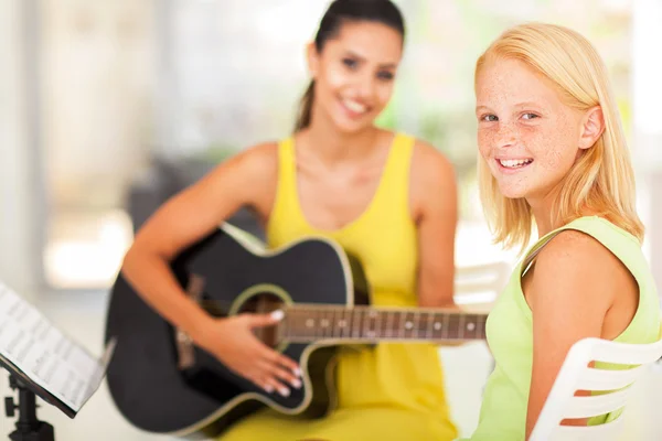 Pre teen girl in music class