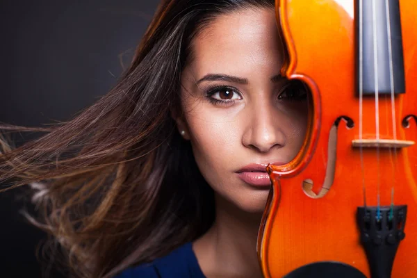 Pretty woman behind a violin