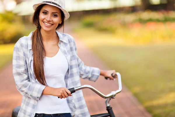 Young woman riding bike outdoors