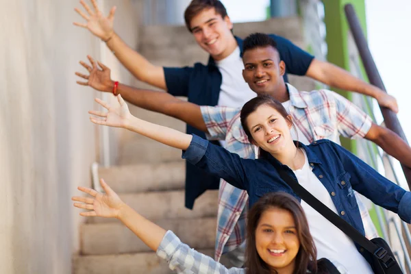 Playful group of teenage students