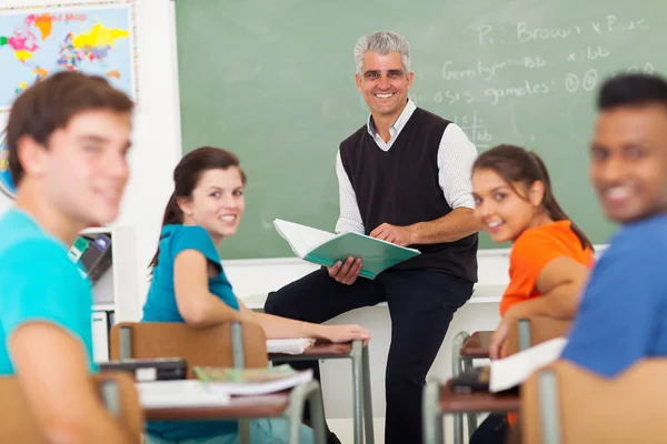 High school teacher and students in classroom