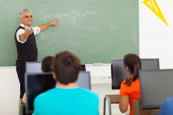 High school teacher teaching computer class